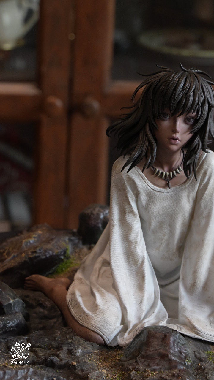 Casca seated in white dress, detail of the Guts and Casca statue base