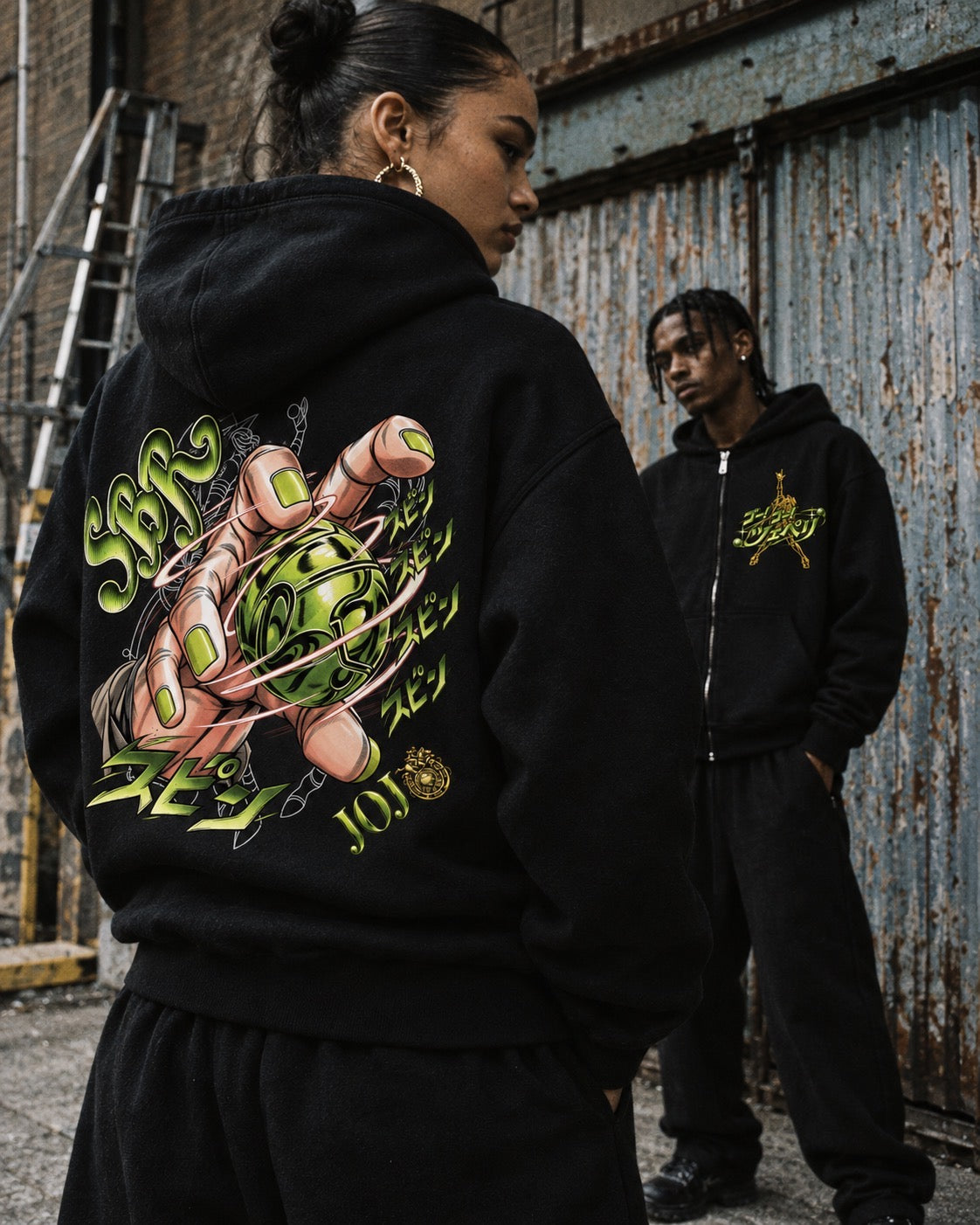 Two models wearing the Steel Ball Run zip hoodie