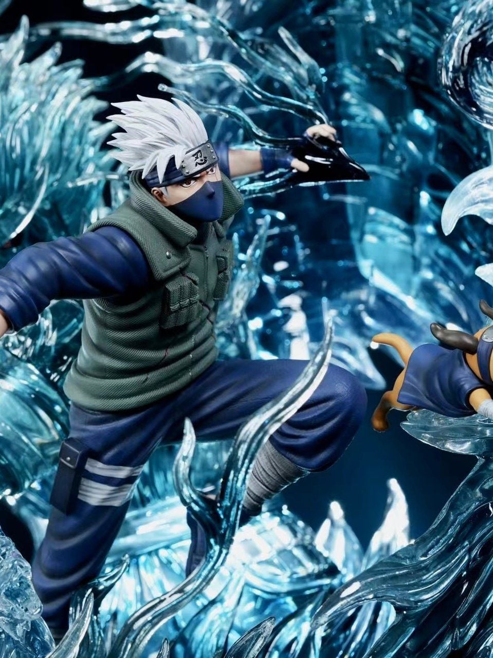 Close-up of Kakashi Hatake statue in Konoha jonin vest holding a blade